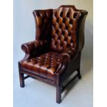 WING ARMCHAIR, 84cm W, George III design buttoned brown leather, with scroll arms and stretchered
