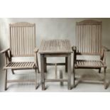 GARDEN ARMCHAIRS AND TABLE, a pair, weathered teak slatted reclining with a matching low table, 53cm