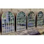 ARCHITECTURAL GARDEN MIRRORS, a set of four, 60cm x 36cm, aged metal frames. (4)