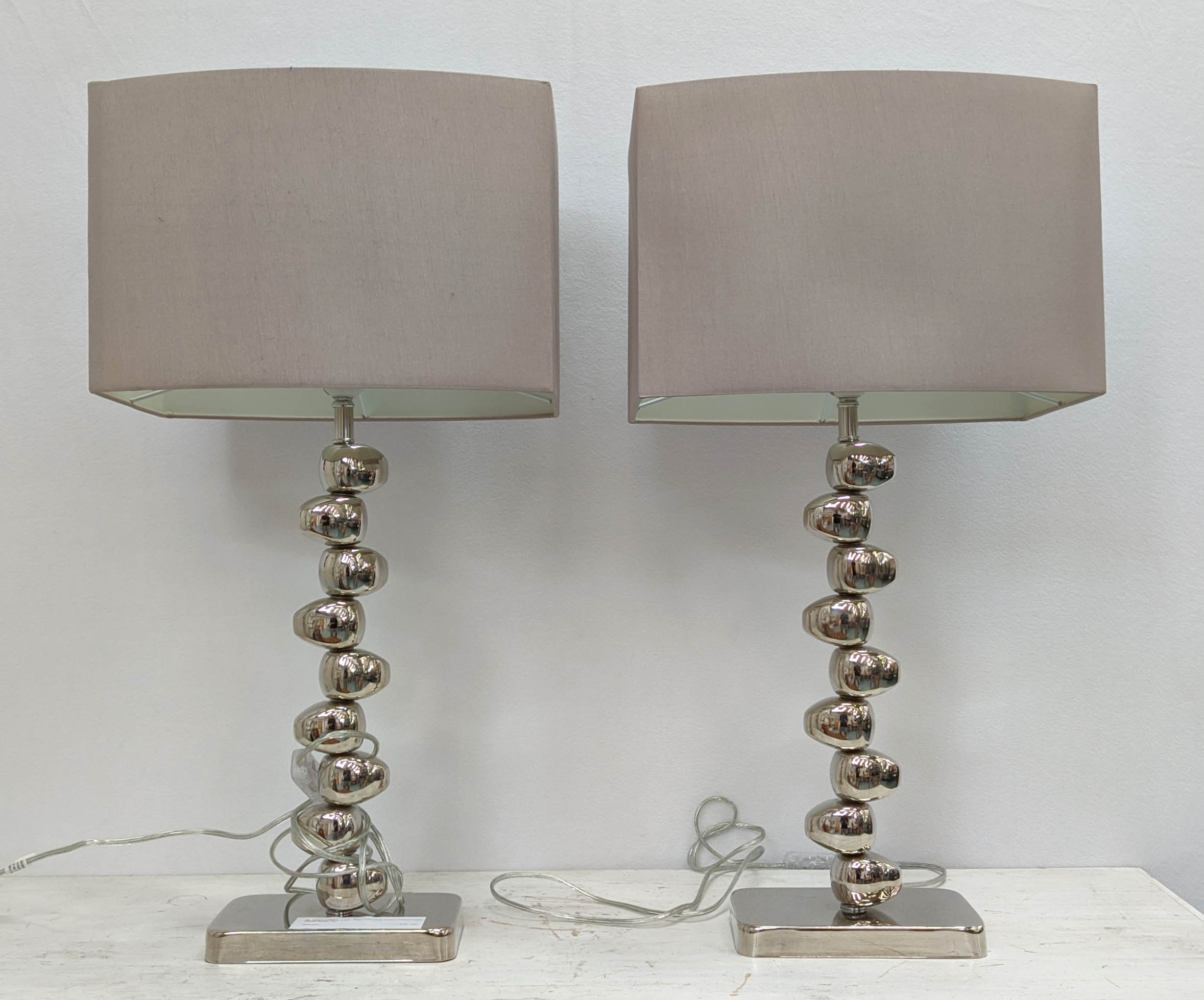 TABLE LAMPS, a pair, 70cm H including shades polished metal pebble design. (2)