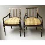 ARMCHAIRS, a pair, Regency style ebonised and gilded with Greek key decoration and cane seats,