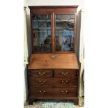 BUREAU BOOKCASE, 111cm W x 216cm H x 58cm D George III mahogany with a later associated, astragal