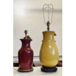 TABLE LAMP, yellow 43cm H on carved Chinese base and a sang de boef lamp, 35cm H.
