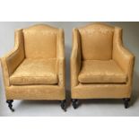 ARMCHAIRS, a pair, early 20th century two tone yellow damask with ebonised reeded supports, 71cm