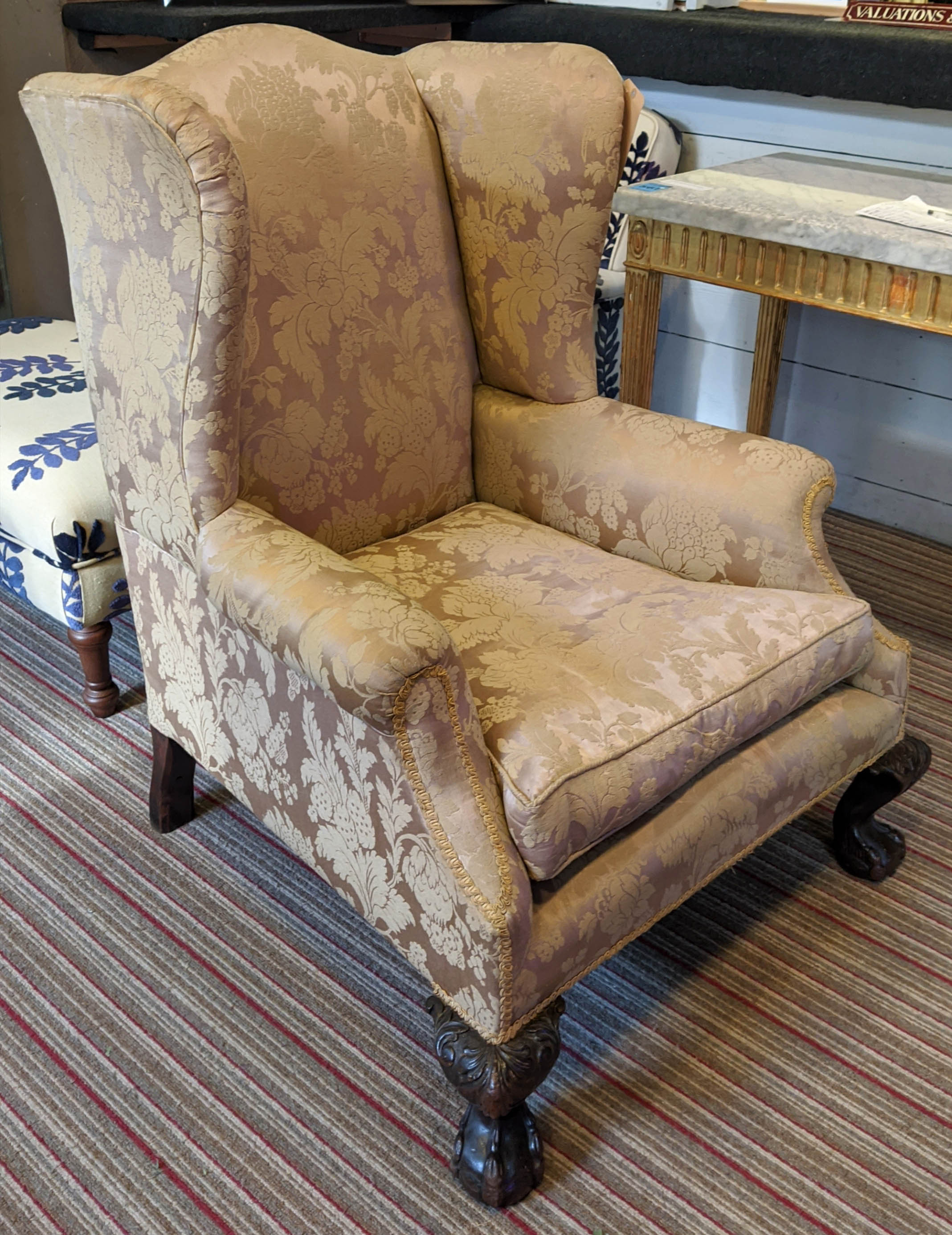WINGBACK CHAIR, 76cm W x 104cm H, damask upholstery, with claw and ball carved supports.