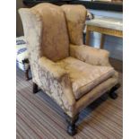 WINGBACK CHAIR, 76cm W x 104cm H, damask upholstery, with claw and ball carved supports.