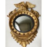 CONVEX WALL MIRROR, 65cm W x 89cm H, 19th century, giltwood circular frame with eagle crest and