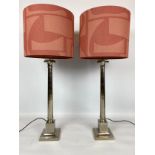 COLUMN LAMPS, a pair, silvered metal, with abstract shades, 100cm H. (2)