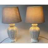 TABLE LAMPS, a pair, reticulated white ceramic of vase form with shades, 76cm H. (2)