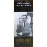 JAMES BOND POSTER, 'George Lazenby' James Bond the Legacy, 106cm x 41cm, framed.
