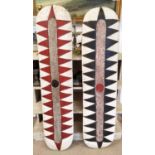 FANG SHEILDS, a pair, Gabon (red, black, white), carved wood, painted finish, 133cm H x 35cm. (2)