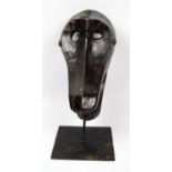 BAOULE RITUAL MONEY MASK, Ivory Coast, carved wood, on stand, 36cm h x 26cm.