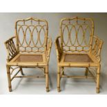 FAUX BAMBOO ARMCHAIRS, a pair, hand painted faux bamboo with cane panelled seats, 66cm W. (2)