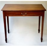 WRITING TABLE, George III period mahogany with full width frieze drawer, line inlay and tapering