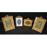 PICTURE FRAMES, a pair, 19th century French ormolu, Empire style, cast decoration with silk fabric