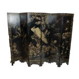 CHINESE SCREEN, six fold, black lacquer with gilt painted decoration depicting a peacock, parrots,