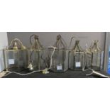 HALL LANTERNS, five, two approx 42cm H, three 32cm H, brass and glass. (5)