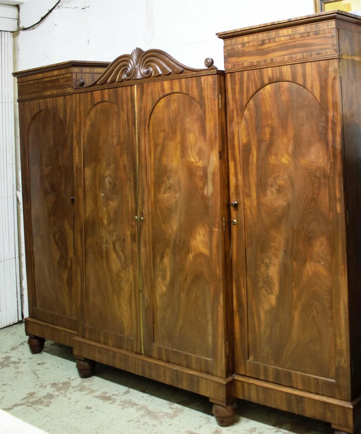 WARDROBE, 228cm L x 188cm H x 61cm D William IV mahogany with four arched panelled doors, the centre