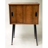 CABINET, 1960's teak with two doors, divisions and swept black brass tipped supports, 50cm W x