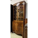 BOOKCASE, 92cm W x 34cm D x 218cm H, Edwardian mahogany of serpentine outline with two glazed