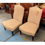 SIDE CHAIRS, 54cm W, a pair, Napoleon III ebonised in patterned cream material on castors. (2)