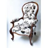 ARMCHAIR, 19th century walnut showframe carved with buttoned autumnal rose white cotton
