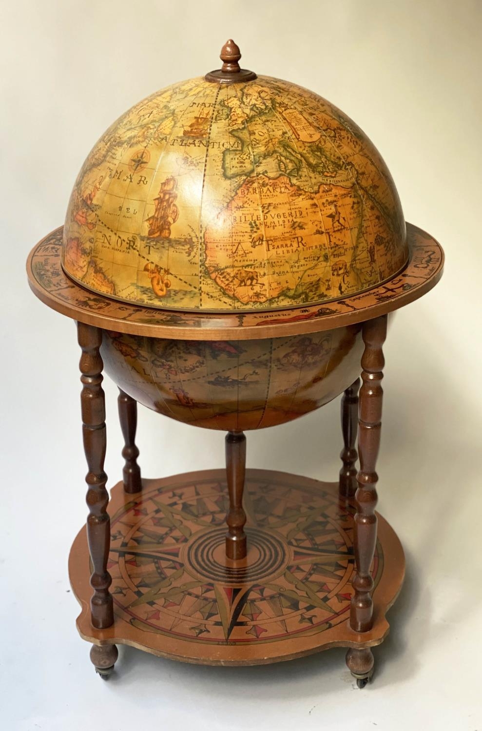 GLOBE COCKTAIL CABINET, in the form of an antique terrestrial globe with rising lid, 94cm H.