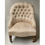 SLIPPER ARMCHAIR, Victorian cream silk brocade upholstery arched and rounded with turned feet,