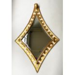 HARRISON GIL WALL MIRROR, antiqued gilded and painted extended lozenge with bevelled mirror and