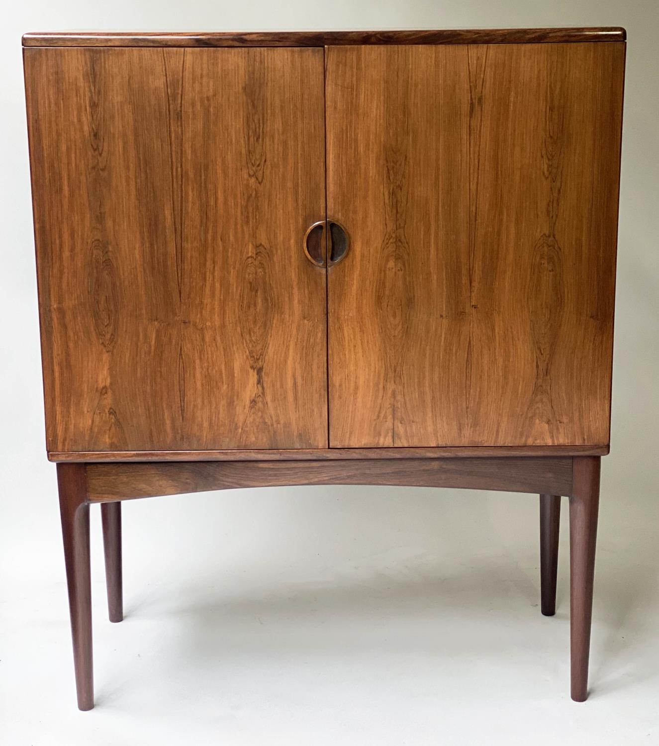 COCKTAIL CABINET, 1970's hardwood, with two panelled doors enclosing fitted lit interior, 90cm W x