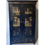 CHINOISERIE WARDROBE, 19th century black lacquered and Chinoiserie panelled with two doors enclosing