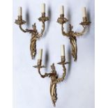WALL LIGHTS, a set of three, Louis XV style gilt metal each two branch, 40cm H. (3)