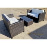 GARDEN SOFAS, a pair, 129cm W with drinks table, faux rattan 89cm x 39cm x 44cm. (3)