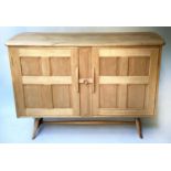 ERCOL SIDEBOARD, mid 20th century, solid elm, in Arts and Crafts style, with two panelled doors,