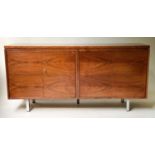 SIDEBOARD, 1970's exotic hardwood, with book matching veneer, four doors and steel supports, 152cm x