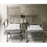 GARDEN ARMCHAIRS, two weathered folding teak, one labeled Westminster, with a rectangular slatted