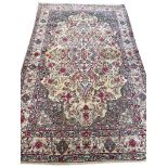 ANTIQUE KERMAN LAVER RUG, 197cm x 128cm.