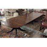 TRIPLE PEDESTAL DINING TABLE, Georgian style mahogany with two leaves and brass castors, extended