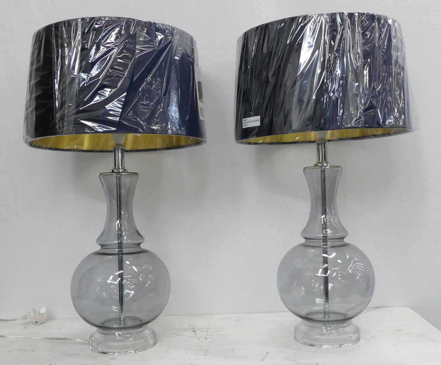 COACH HOUSE TABLE LAMPS, a pair, 68cm H clear glass with shades. (2)