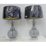 COACH HOUSE TABLE LAMPS, a pair, 68cm H clear glass with shades. (2)