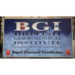 BGI ADVERTISING SIGN, 116cm H x 207cm W, back lit, encased in a metal frame.