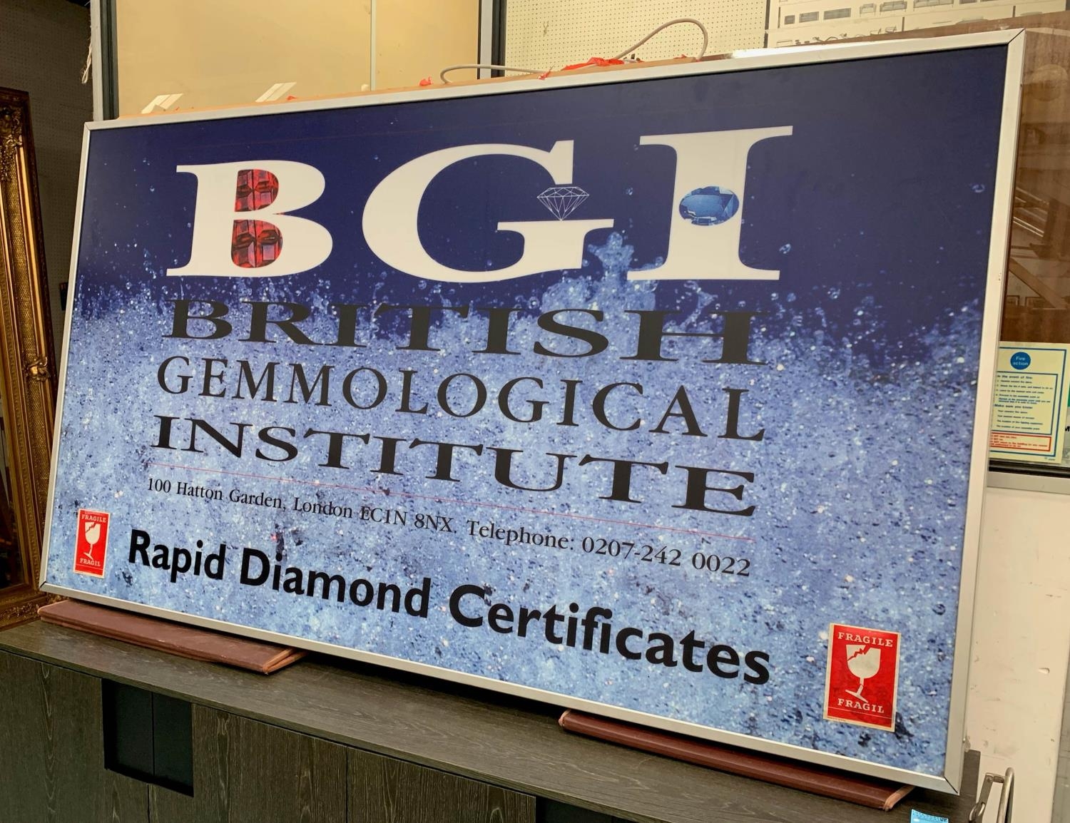 BGI ADVERTISING SIGN, 116cm H x 207cm W, back lit, encased in a metal frame. - Image 2 of 3