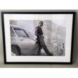 SEAN CONNERY WITH THE ASTON MARTIN, print, framed and glazed, 83cm x 65cm.