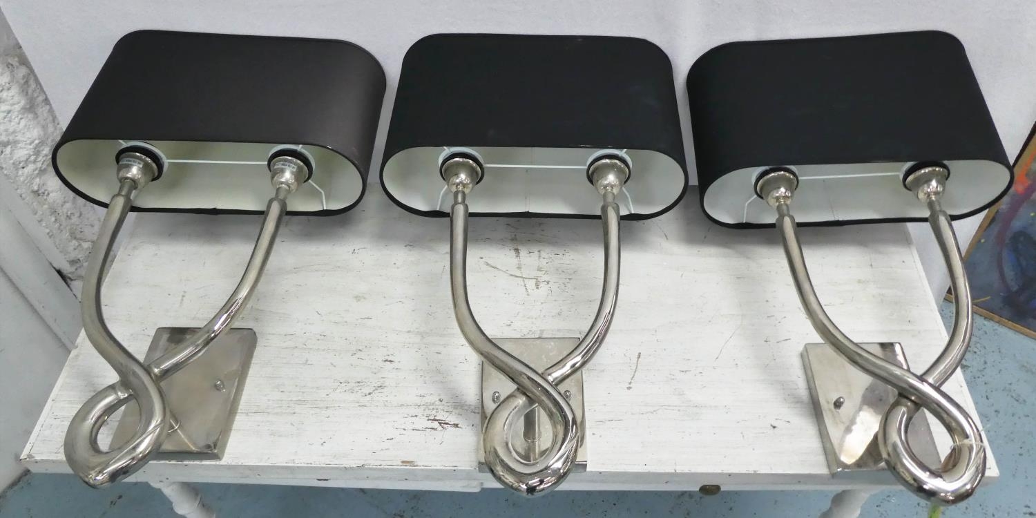 COACH HOUSE WALL SCONCES, three, bases each 50cm H x 25cm W, polished metal with black shades. (3)