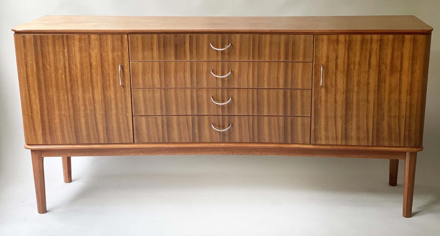 GORDON RUSSELL STANWAY SIDEBOARD, 1960 teak and Indian Laurel, concave with four drawers flanked