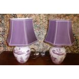 TABLE LAMPS, a pair, 48cm H each decorated with figures and purple cream bordered shades. (2)