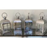 STORM LANTERNS, a set of four, polished metal, 44cm H. (4)