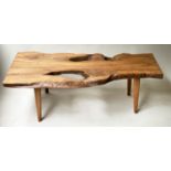 LOW TABLE, Naturalistic tree section, burr yew, on splay supports, 126cm W x 58cm D.