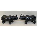 CONTEMPORARY SCHOOL, a pair, sculptural rhinos, 23cm x 38cm x 14cm, black glazed ceramic. (2)