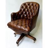 REVOLVING DESK CHAIR, 1970's Norwegian deep buttoned brown leather revolving and reclining on an